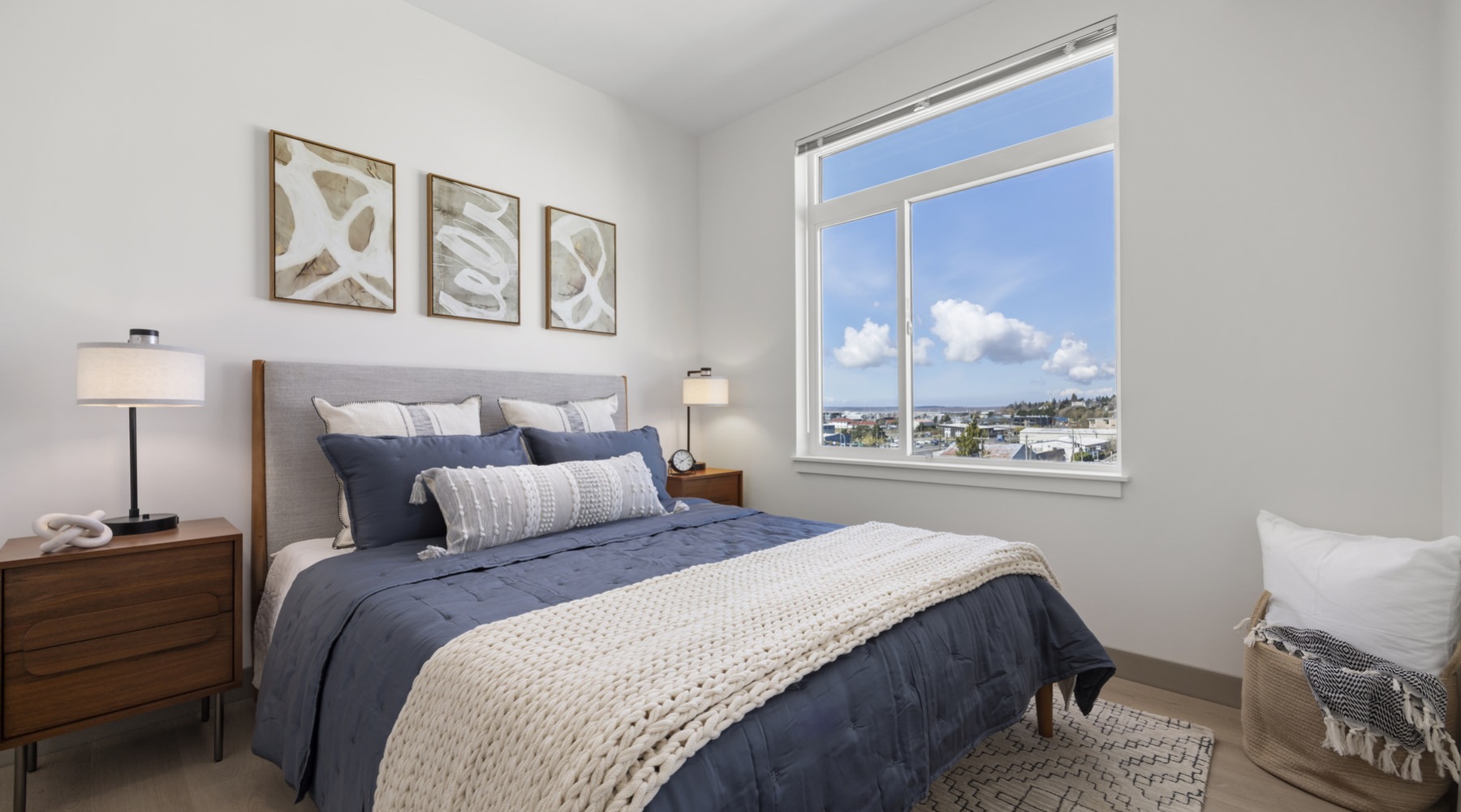 a bedroom with a bed and two nightstands