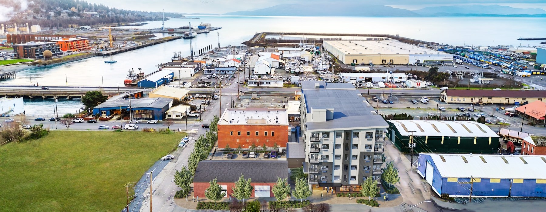 a group of buildings next to a body of water