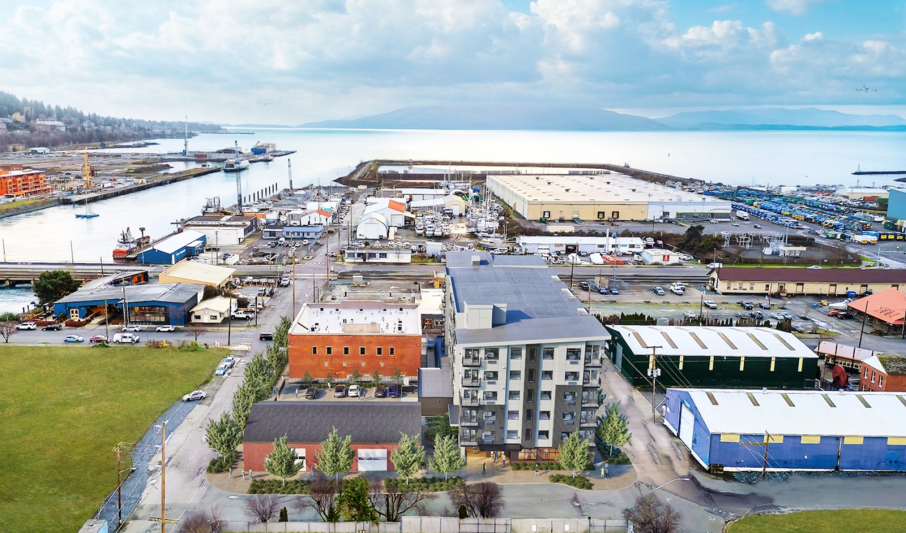 a group of buildings next to a body of water