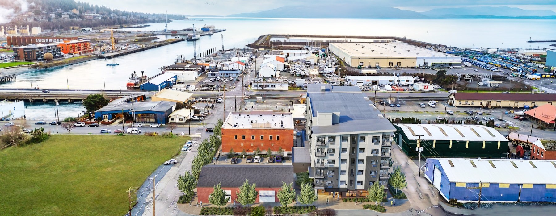a group of buildings next to a body of water