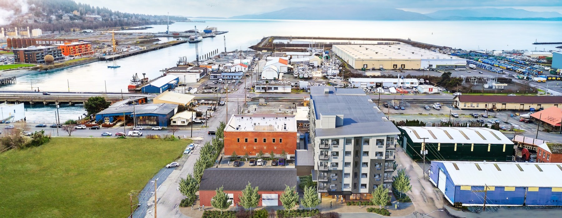 a group of buildings next to a body of water